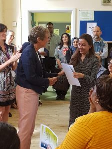 Learner receiving certificate at MAES celebration event 2019
