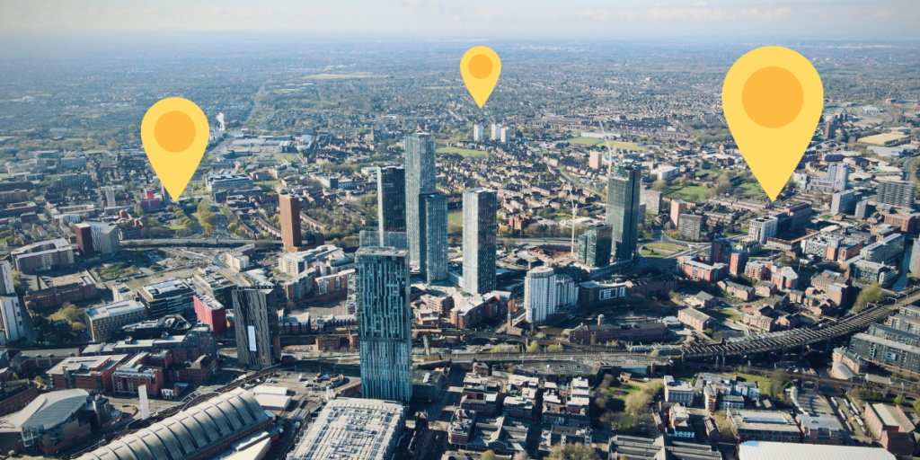 Aerial view of Manchester with yellow location pins