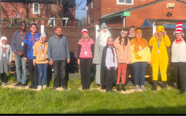 Group of young learners dressed up in costumes to celebrate world book day