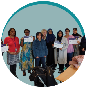 Group of women holding certificates smiling at the camera inside a green decorative circle graphic
